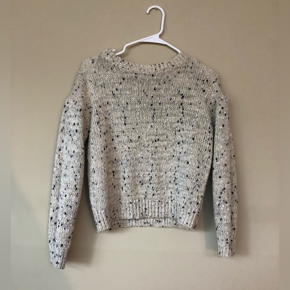 A gently used knitted cardigan